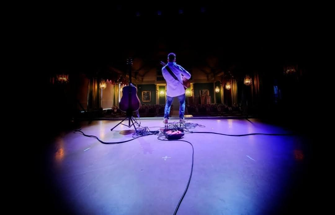 Acoustic guitar performance on stage